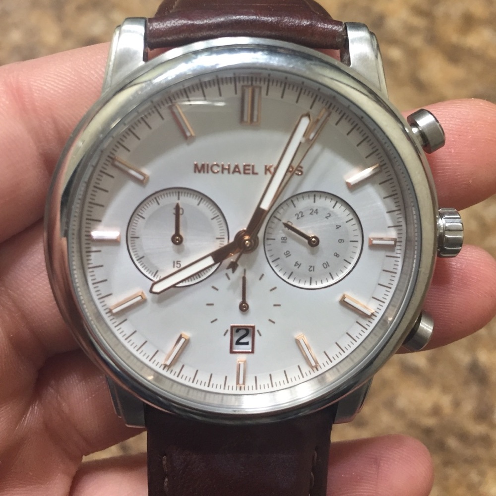 Men’s MK watch. Has glow in the dark arms as well.
